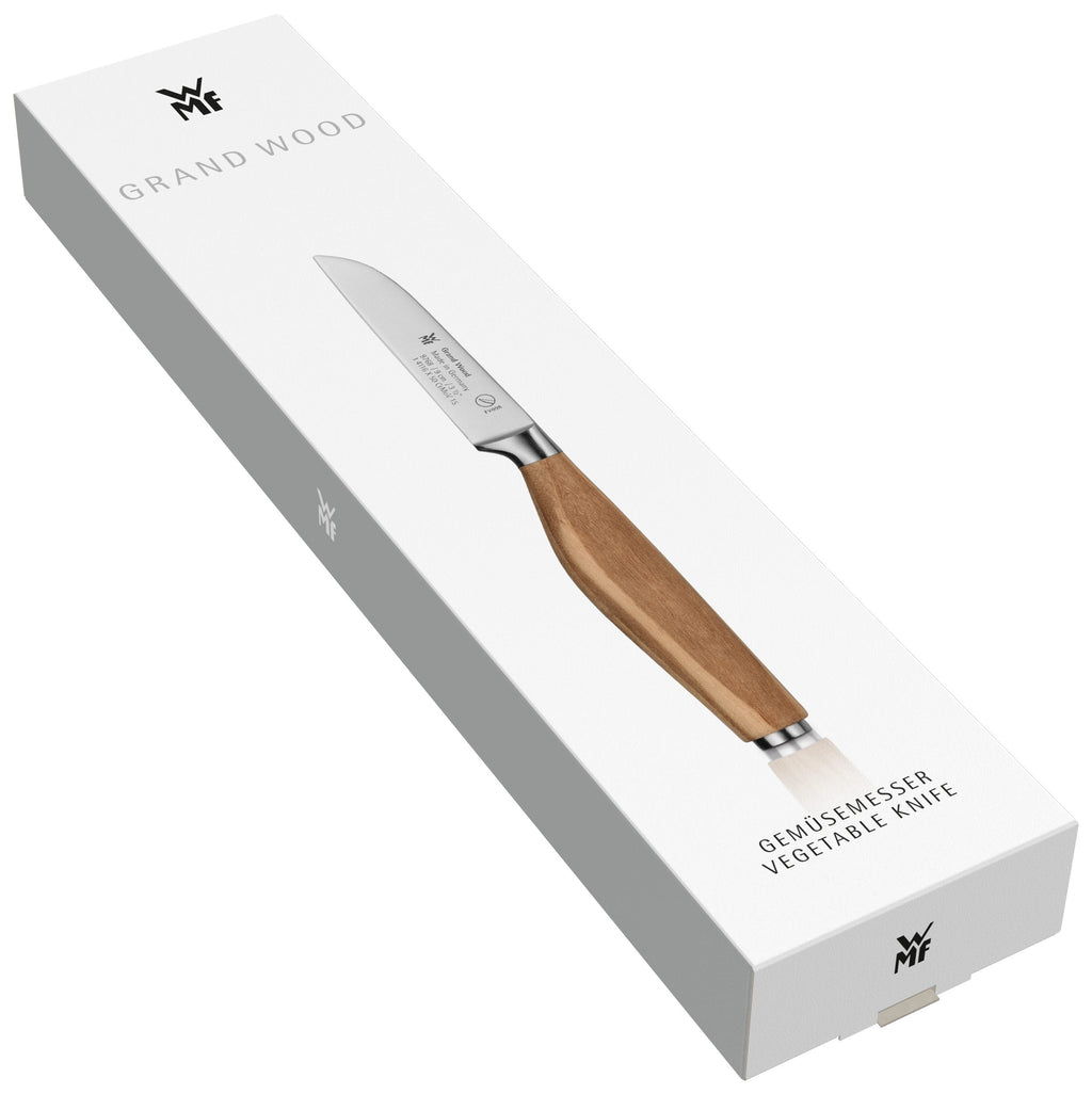 Grønnsakskniv 9 cm Grand Wood oliventre - WMF liggende på kjøkkenbenk