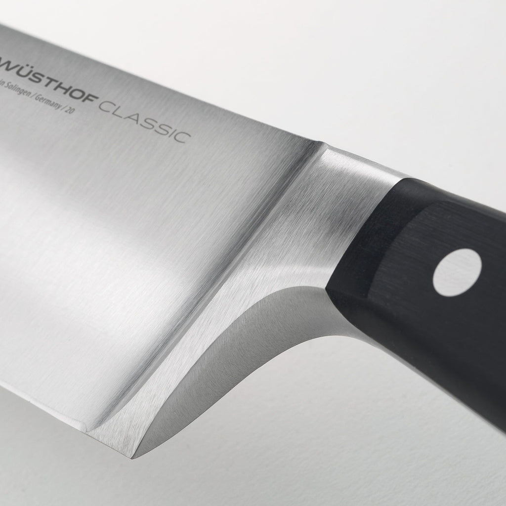 Kokkekniv Classic 20 cm rustfritt stål - Wüsthof med matvarer