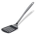 Stekespade med spalter svart rustfritt stål 32,5 cm sett forfra