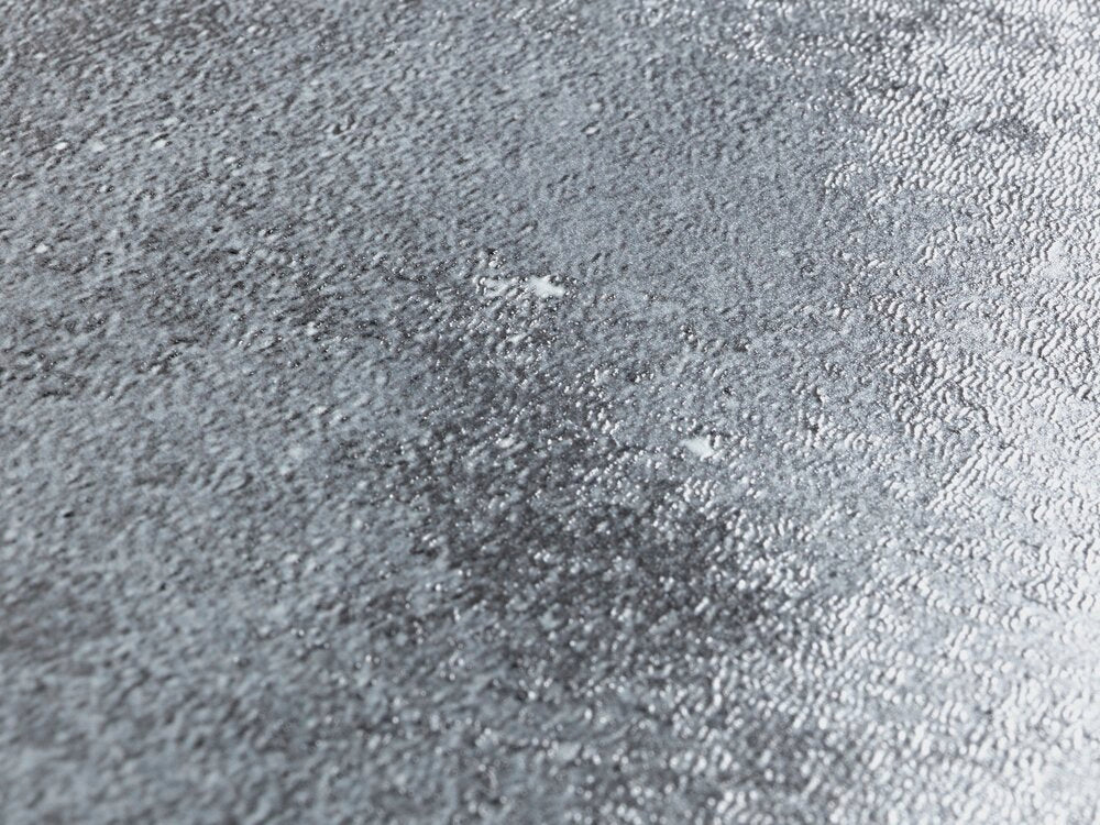 Nærbilde av soft close mekanisme på Toalettsete Cement med relieff og soft close termoplast